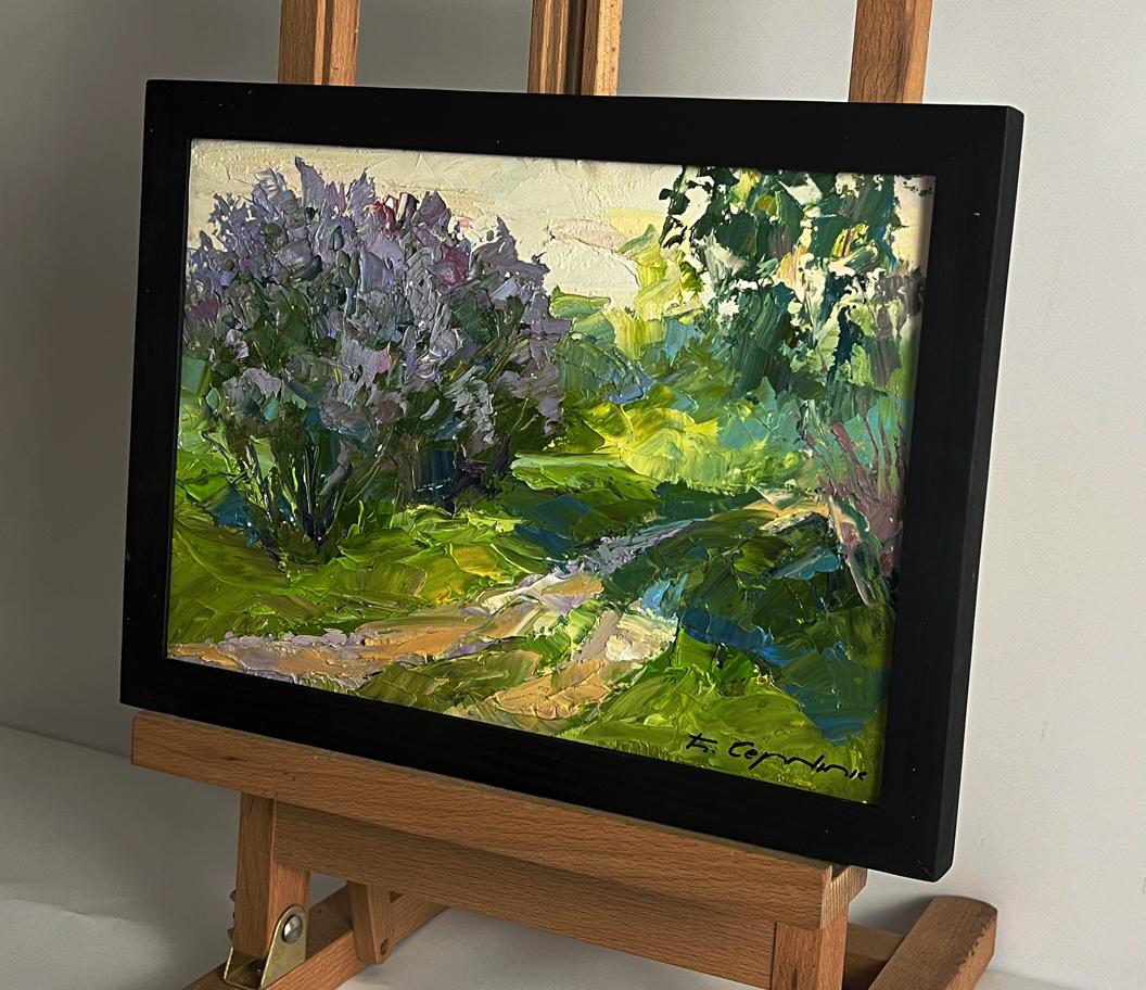 Oil painting Flowers along the road by Boris Serdyuk in black frame on easel