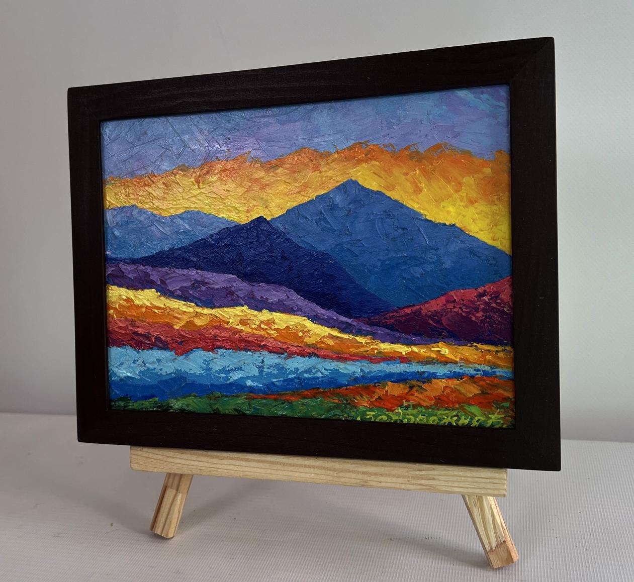 Oil painting of big mountains and sunset by V. Zadorozhnya in wooden frame