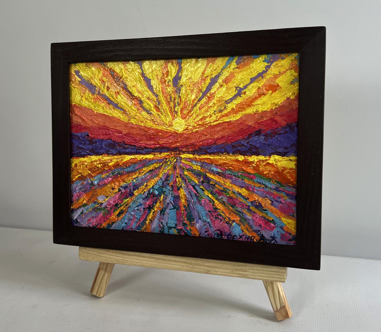 Vibrant oil painting of yellow sunset rays by V. Zadorozhnya in black frame