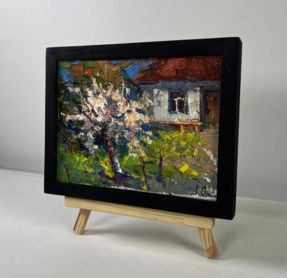 Oil painting Petals under the warm spring sun by Oksana Ivanyuk on wooden easel