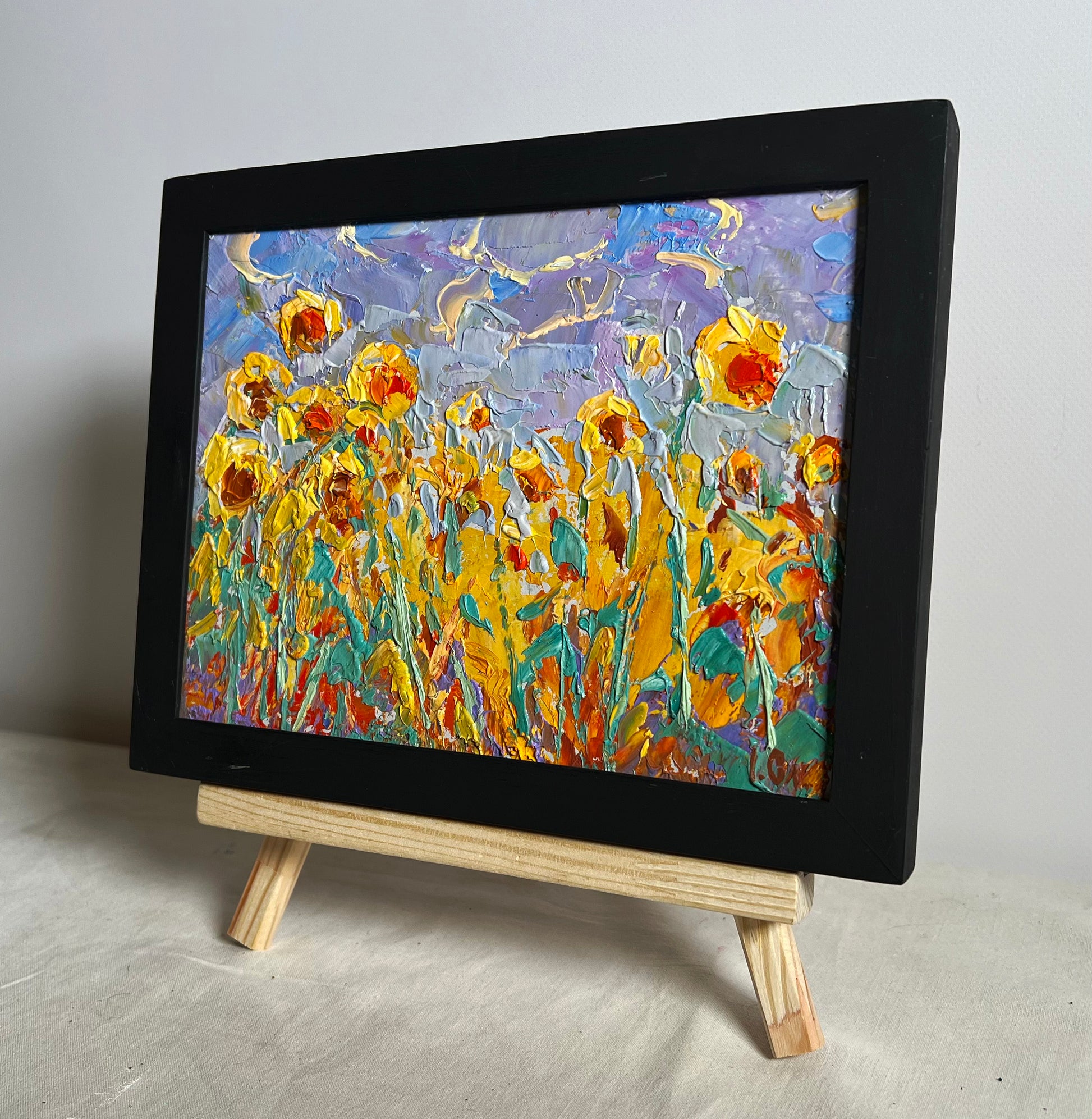 Oil painting To the sky by Oleksiy Ivanyuk: vibrant sunflowers in black frame