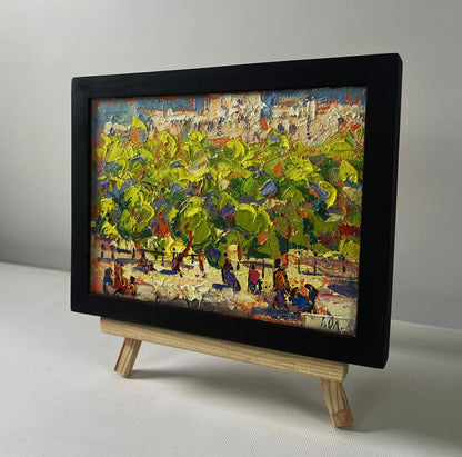 Oil painting Spring city in shade of trees by Oleksiy Ivanyuk in black frame