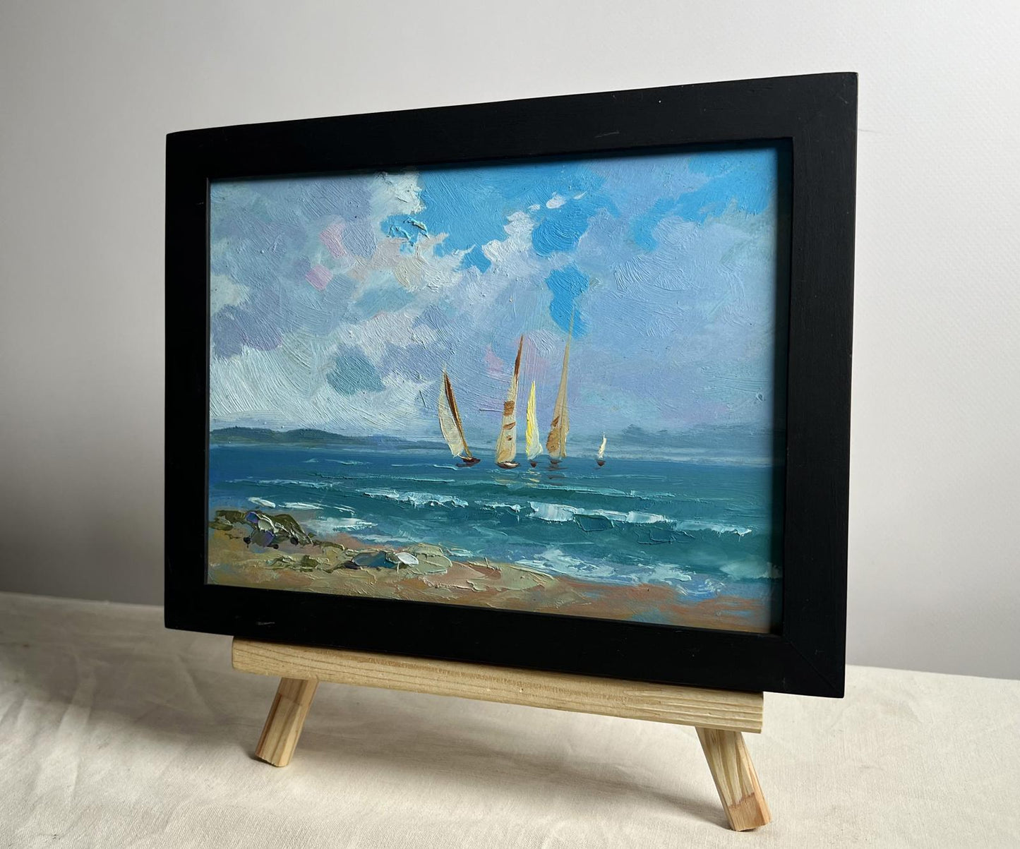 Framed oil painting of sailboats at sea by Yuriy Suprunchuk