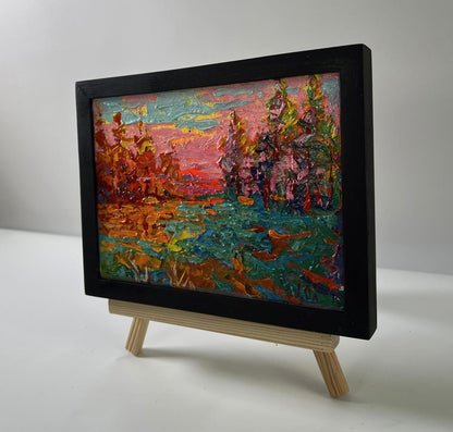 Vibrant textured oil painting of pink evening sunset forest by Oleksiy Ivanyuk in black frame