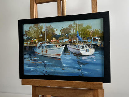 Framed impressionistic oil painting of white boats in harbor by Yuriy Suprunchuk