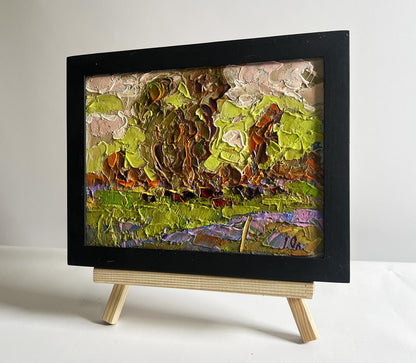 Oil painting Lush Meadows Behind the Village by Oleksiy Ivanyuk in black frame