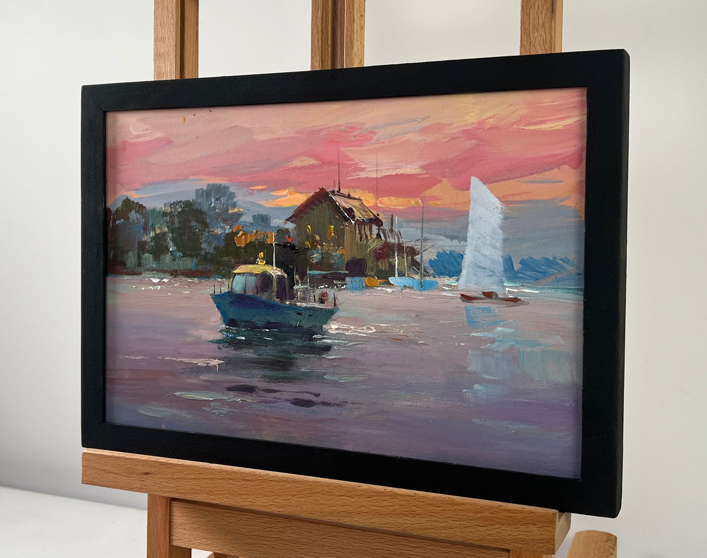 Framed oil painting of harbor boats at sunset by Yuriy Suprunchuk