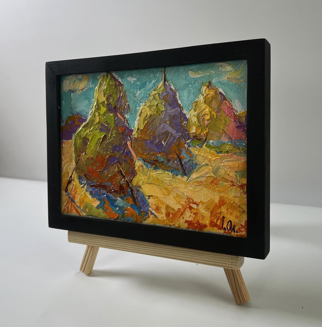 Oil painting Haystacks in a field by Oleksiy Ivanyuk in black frame