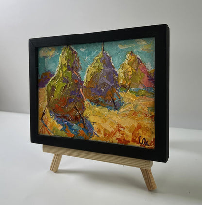 Oil painting Haystacks in a field by Oleksiy Ivanyuk in black frame