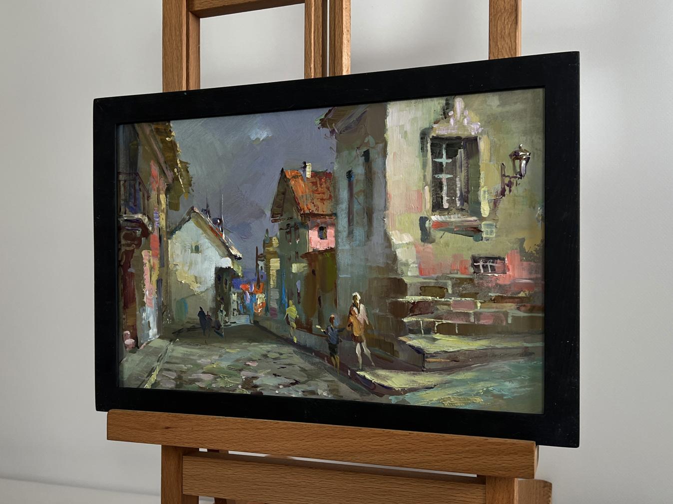 Oil painting Walking along the city street by Yuriy Suprunchuk in black frame