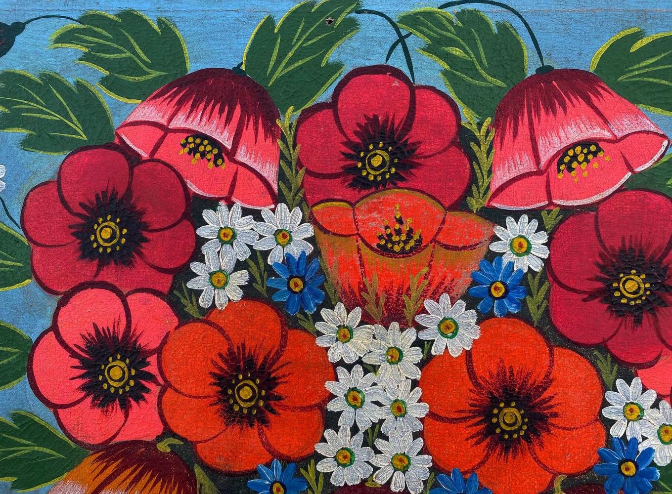 Oil painting of red poppies in basket with daisies and blue flowers