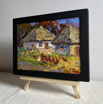 Oil painting by Oksana Ivanyuk: chickens in yard with rustic houses, framed