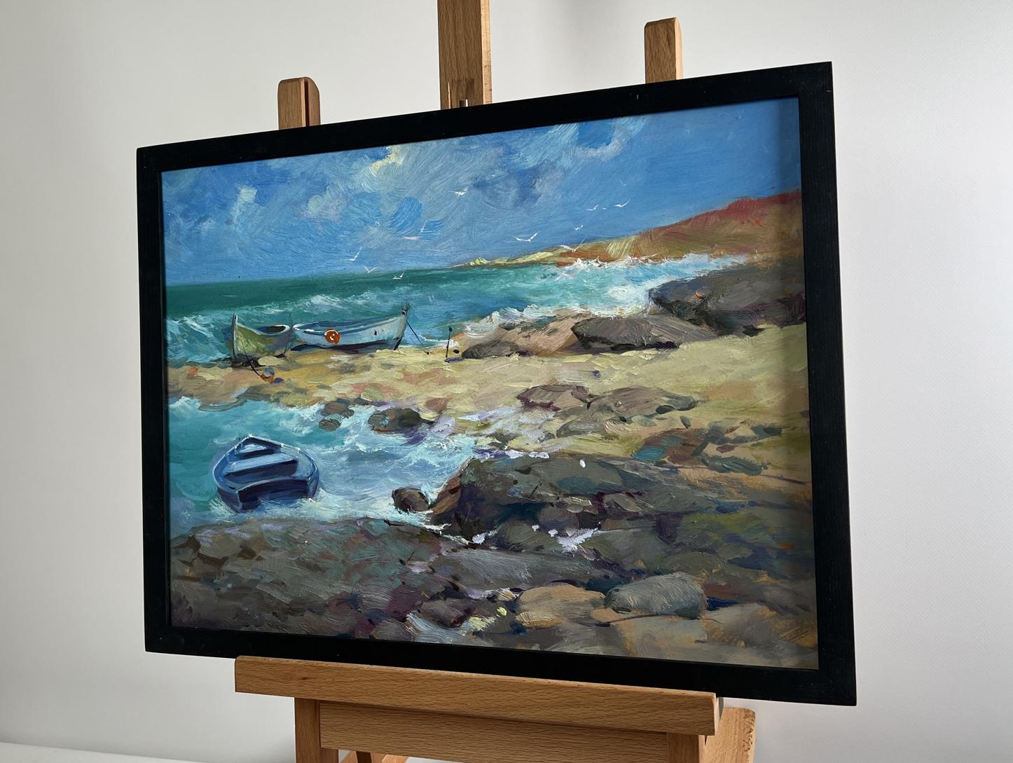 Oil painting Freedom over the Sea by Yuriy Suprunchuk in black frame on easel