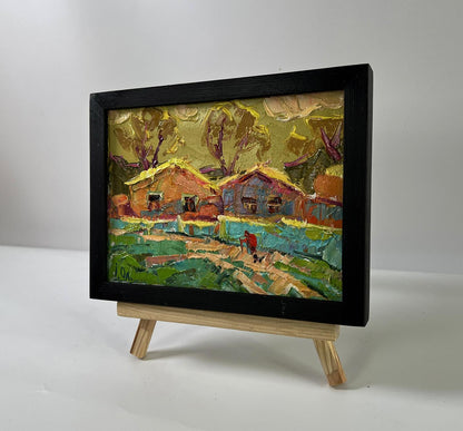 Oil painting of warm village evening by Oleksiy Ivanyuk in black frame