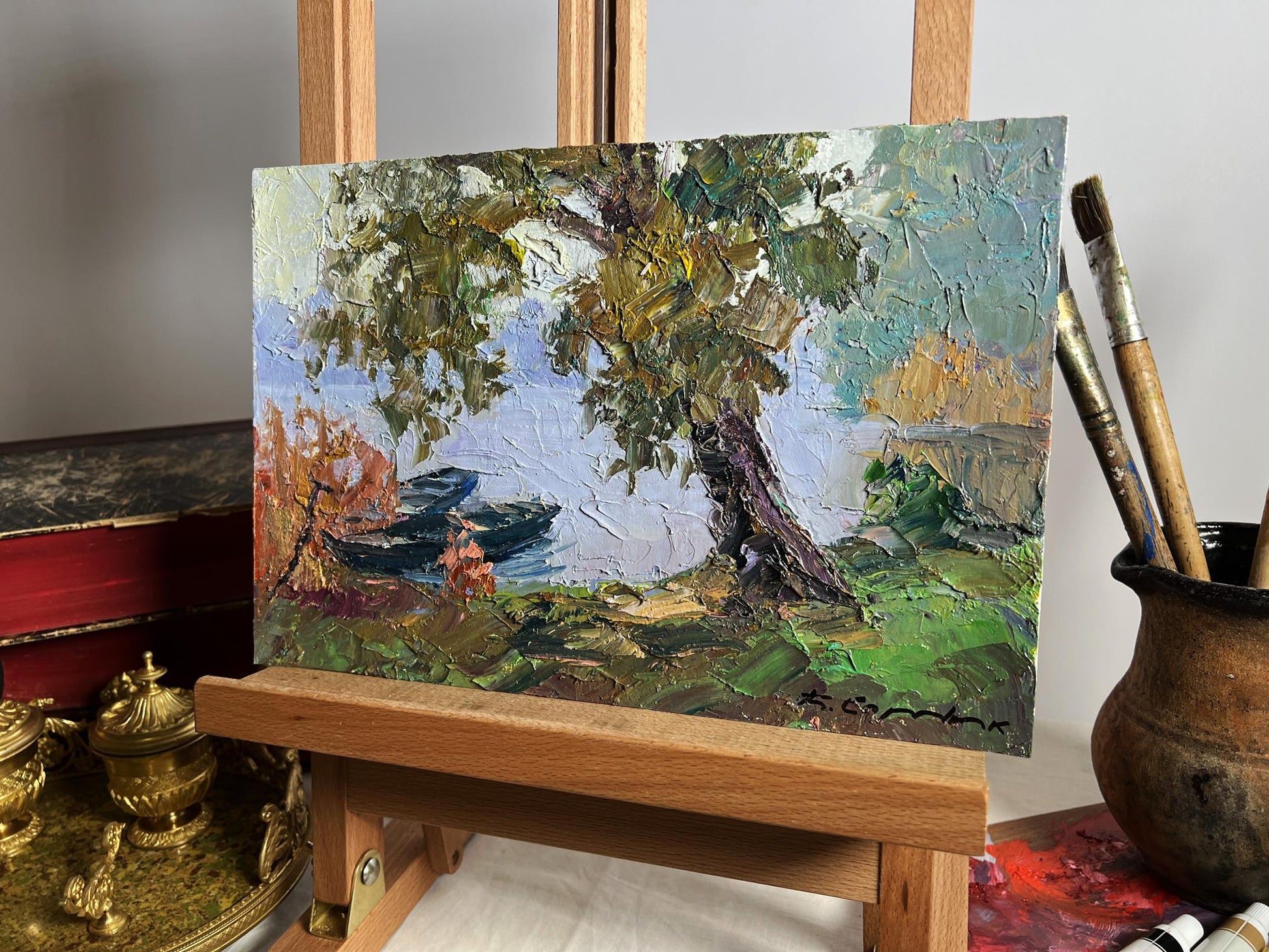 Oil painting Boats on the shore by Boris Serdyuk, tree over water with boats
