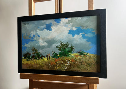 Oil painting of couple in flower field by Yuriy Suprunchuk, framed