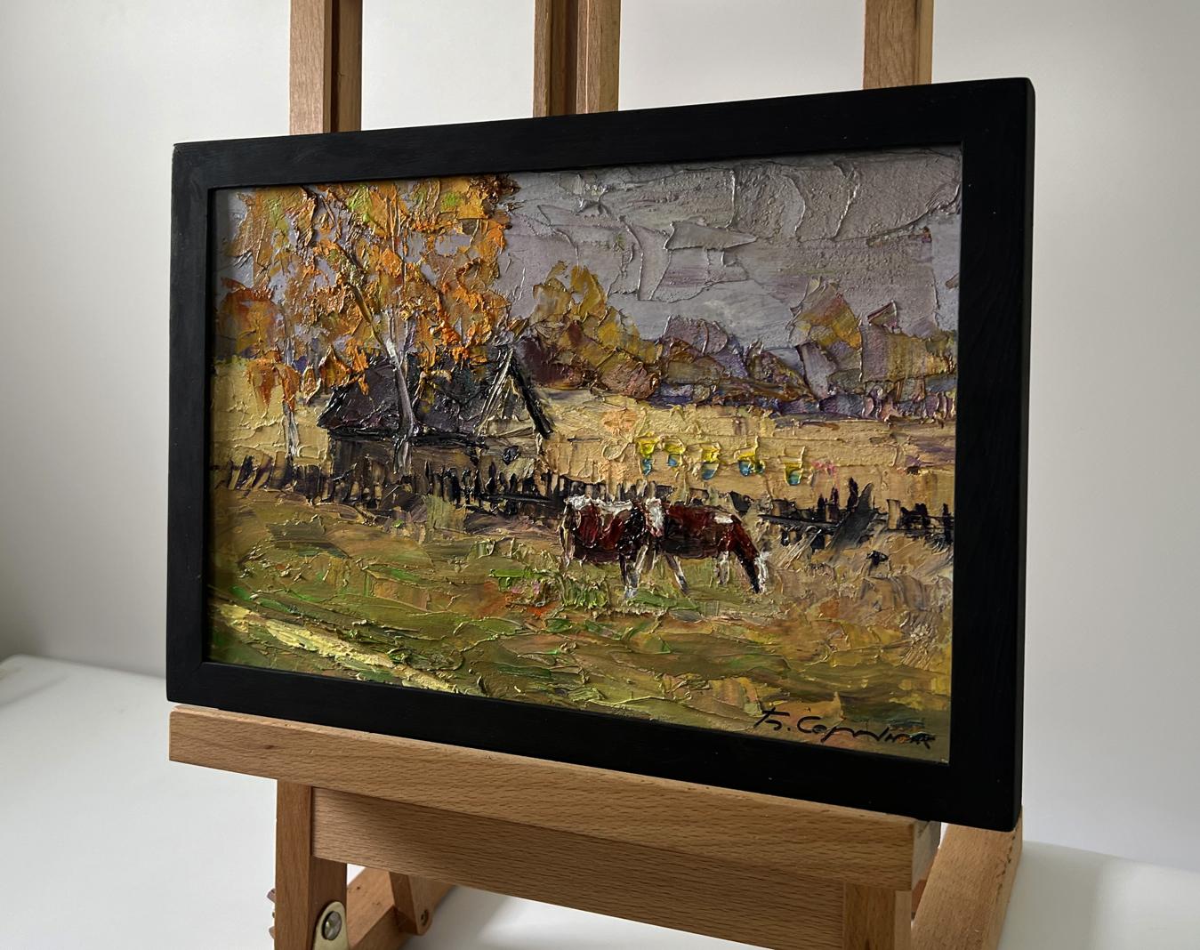 Oil painting of village cows grazing by Boris Serdyuk in black frame