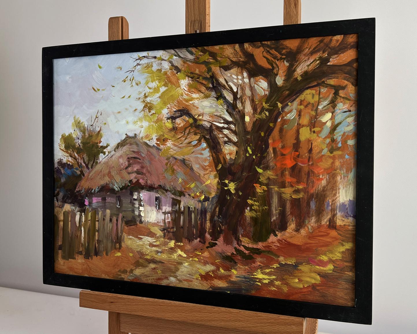 Oil painting of street in golden leaves by Yuriy Suprunchuk in black frame