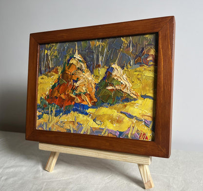 Oil painting of sunny field with autumn trees by Oleksiy Ivanyuk in wood frame