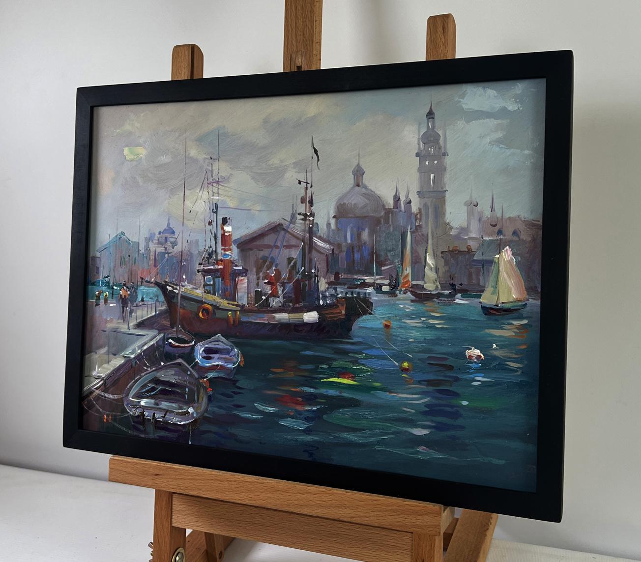 Framed oil painting of boats bobbing at city pier by Yuriy Suprunchuk