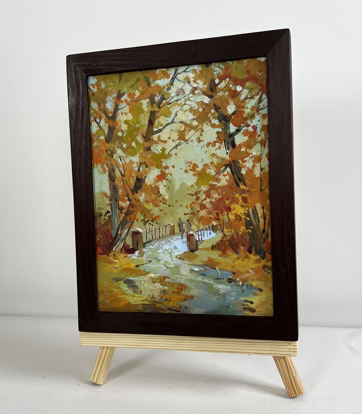 Oil painting Fallen leaves in autumn park by Yuriy Suprunchuk on easel