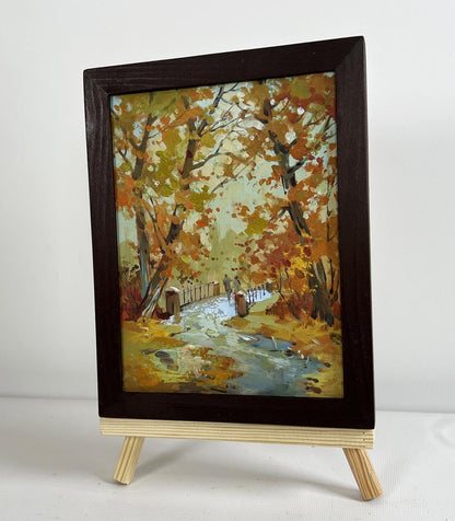 Oil painting Fallen leaves in autumn park by Yuriy Suprunchuk on easel