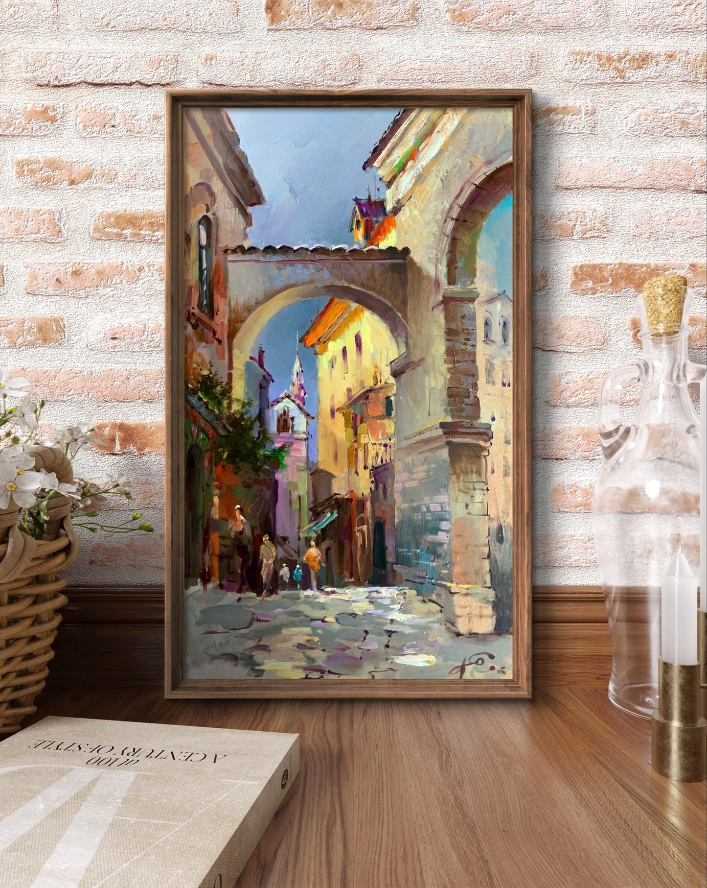Framed oil painting by Yuriy Suprunchuk of sunlit cobblestone alley