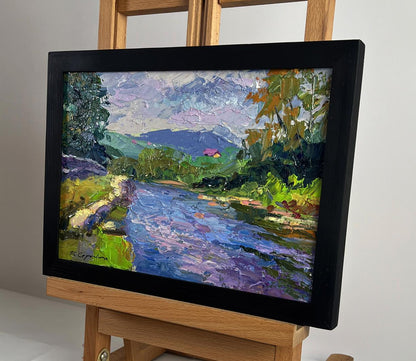 Black-framed oil painting of Boris Serdyuk mountain river landscape