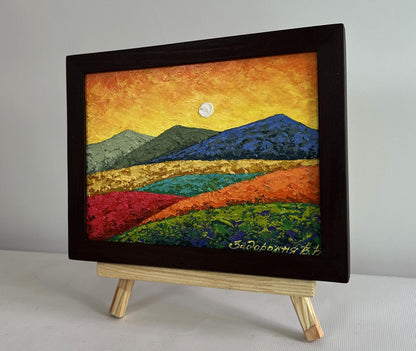 Oil painting by V. Zadorozhnya: sunset behind mountains in wooden frame