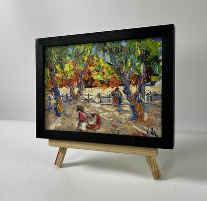 Oil painting On a walk in the city park by Oleksiy Ivanyuk in black frame