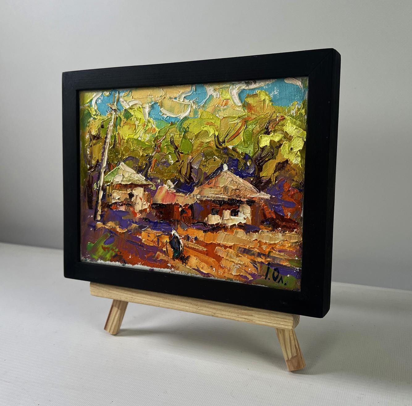 Oil painting by Oleksiy Ivanyuk: warm evening sunset over colorful village