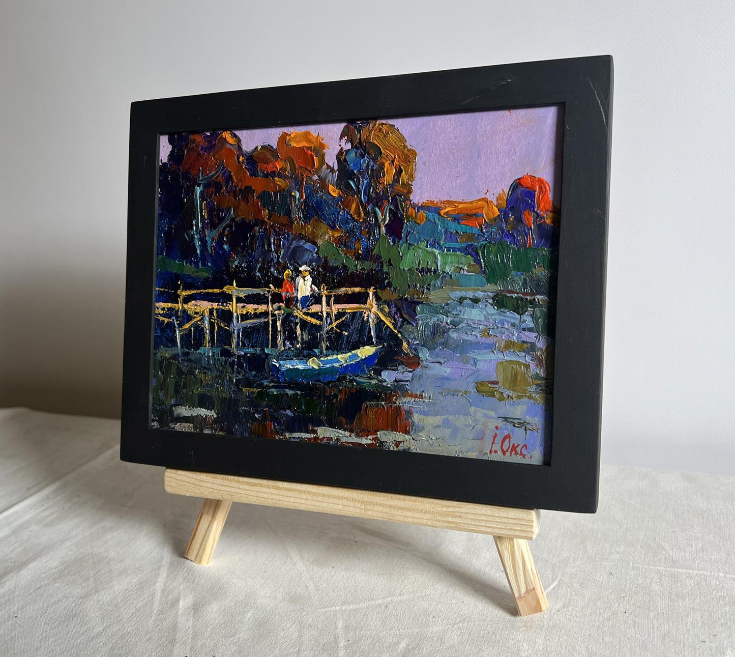 Oil painting by Oksana Ivanyuk: people on pier in impressionist riverside scene
