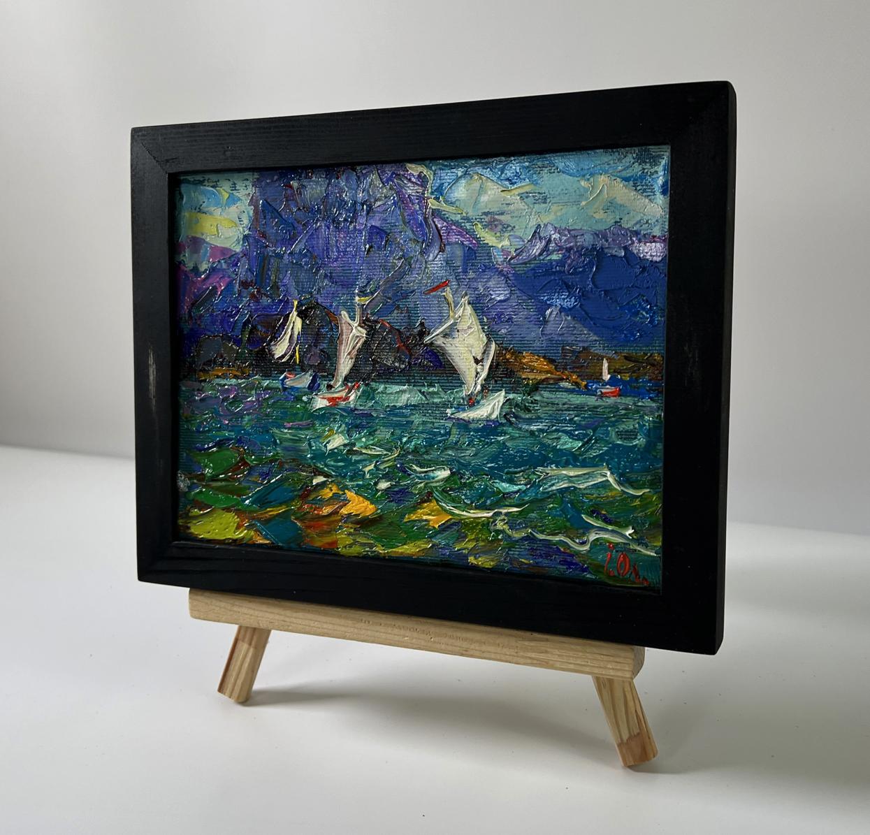 Oil painting of boats on shore by Oleksiy Ivanyuk in black frame