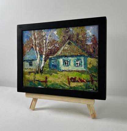 Oil painting Whispers of Spring by Oksana Ivanyuk, rustic village scene in black frame