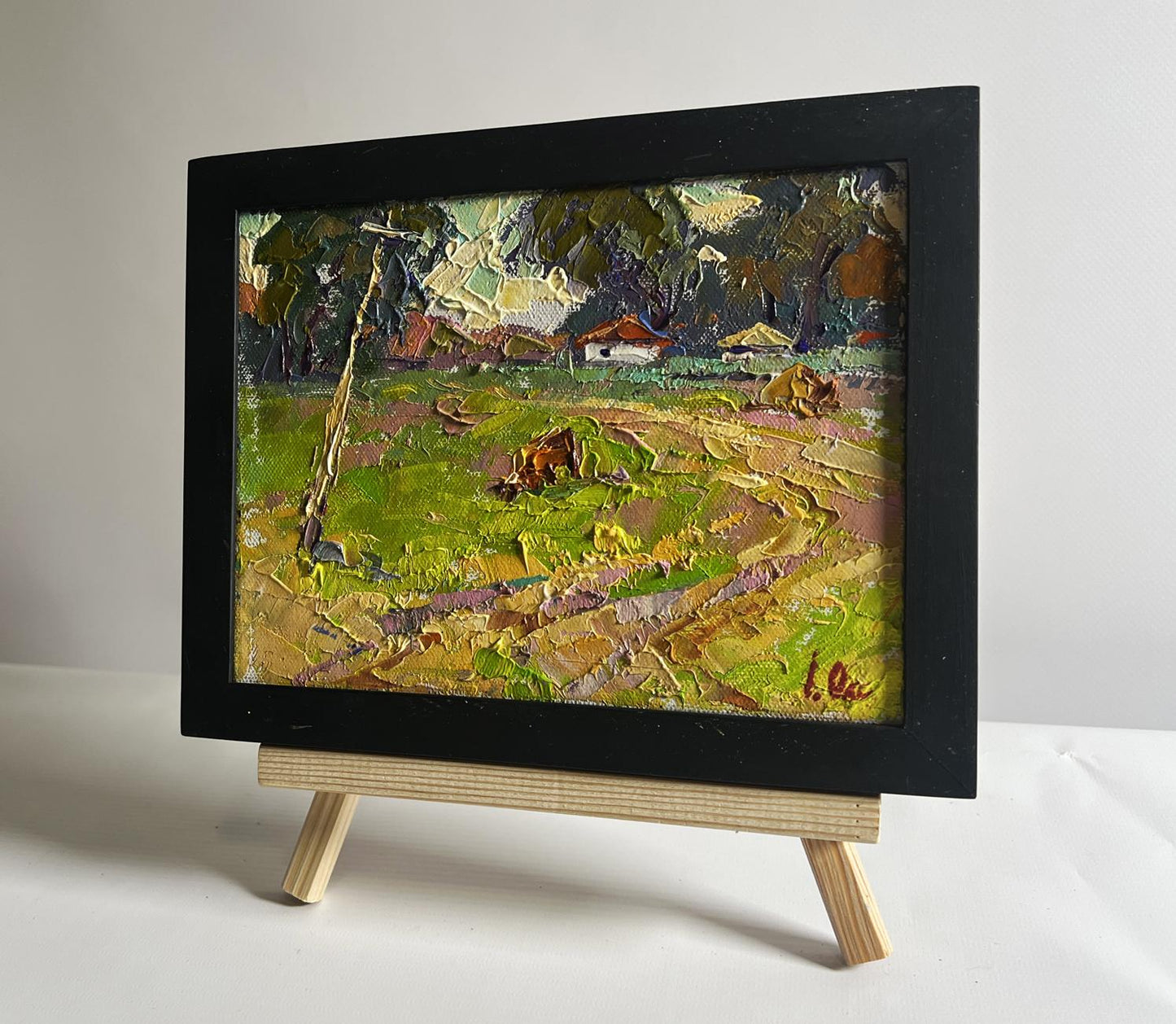 Oil painting The road leading to the village by Oksana Ivanyuk in black frame