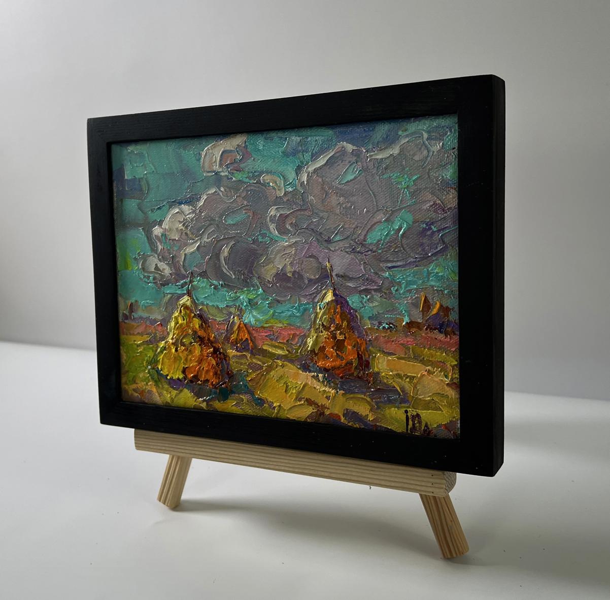 Oil painting Cloudy horizon by Oleksiy Ivanyuk: golden haystacks under teal sky