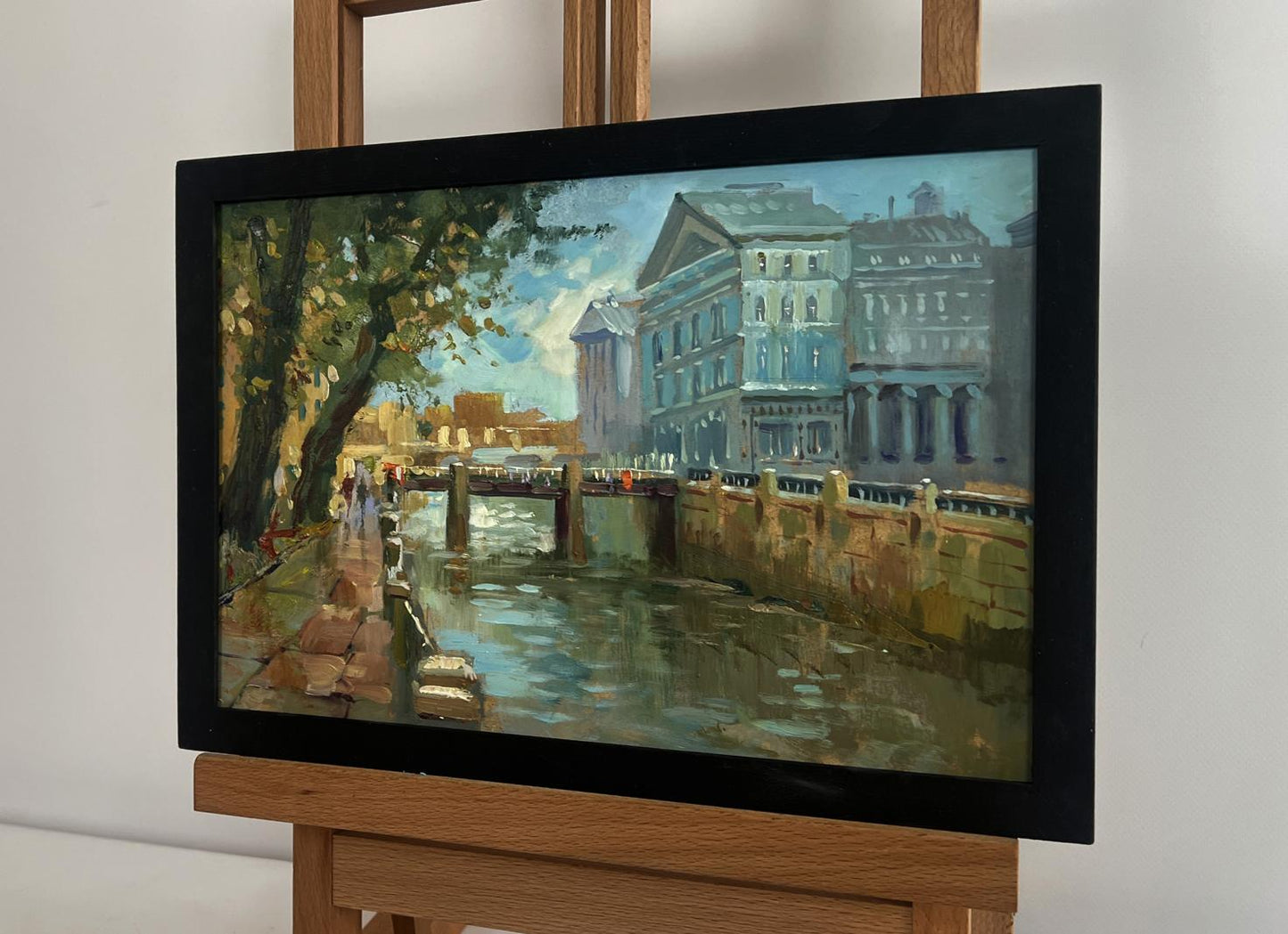 Framed oil painting of serene canal by Yuriy Suprunchuk