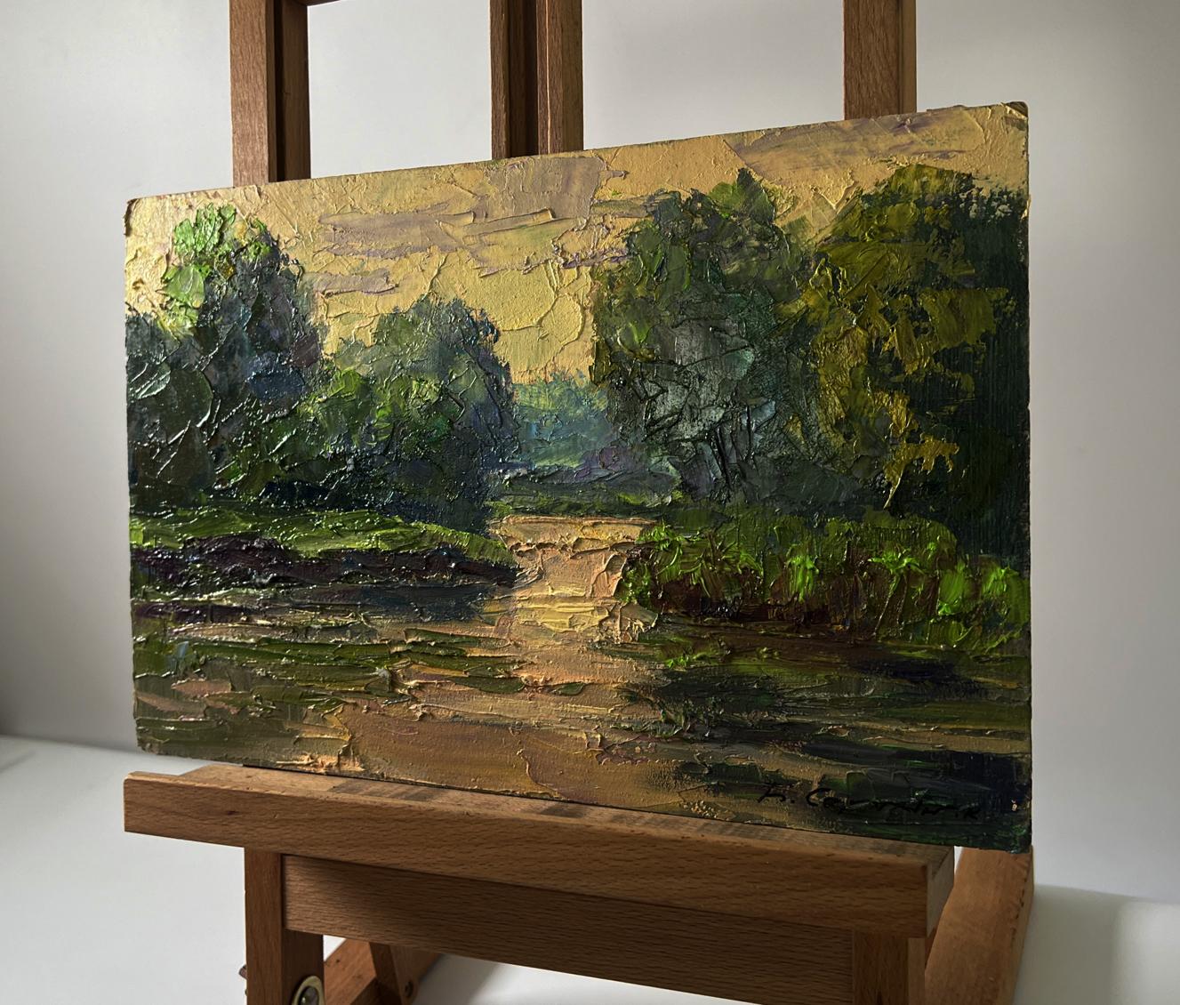Oil painting Spring sunset over the river by Boris Serdyuk on easel