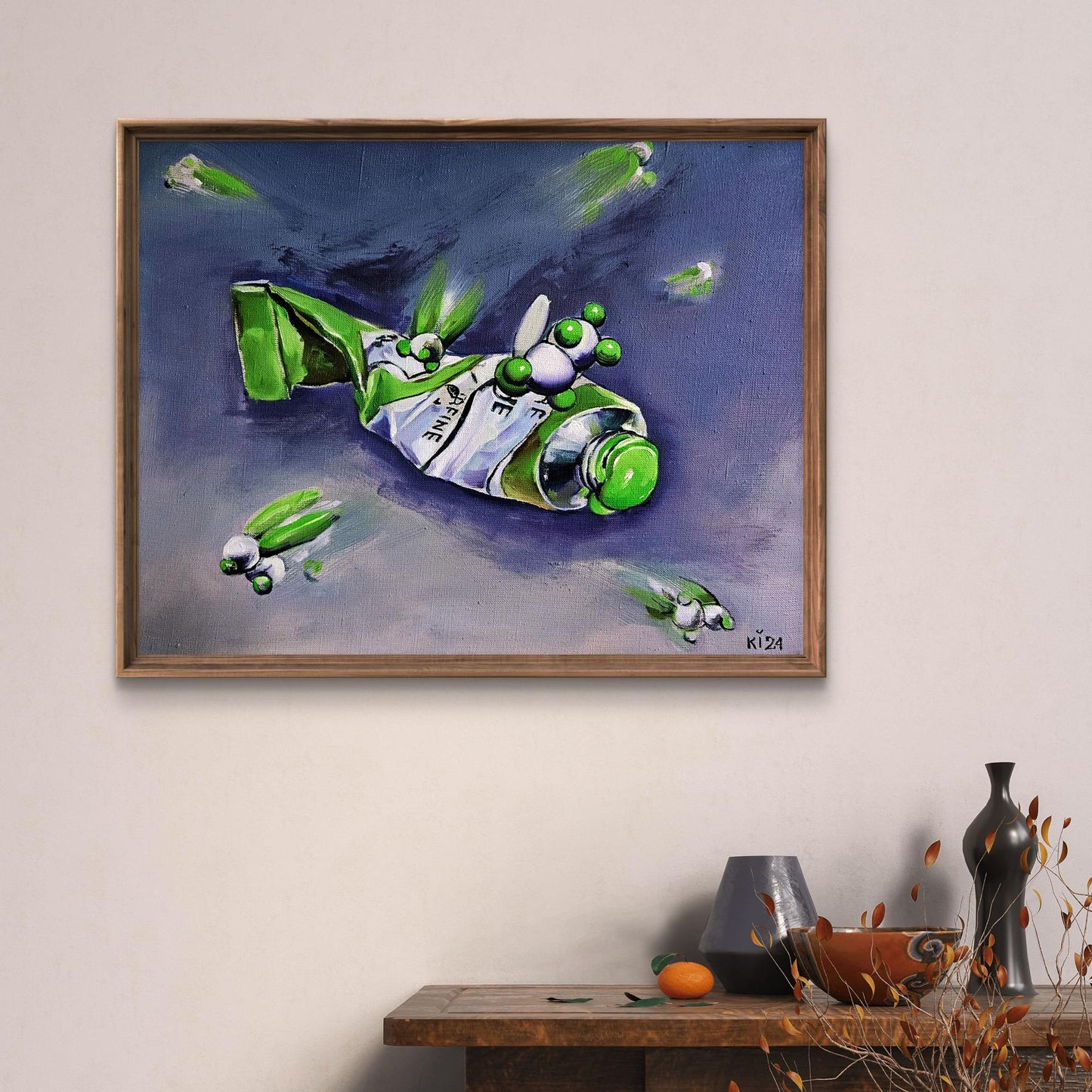 Framed oil painting by Igor Konovalov: green paint tube with googly eyes in space