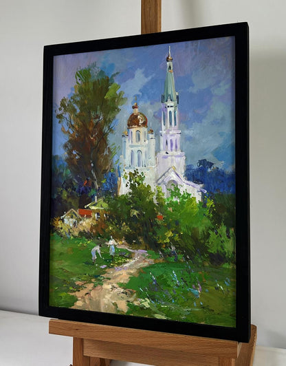 Oil painting of church under shining sky by Yuri Suprunchuk in black frame