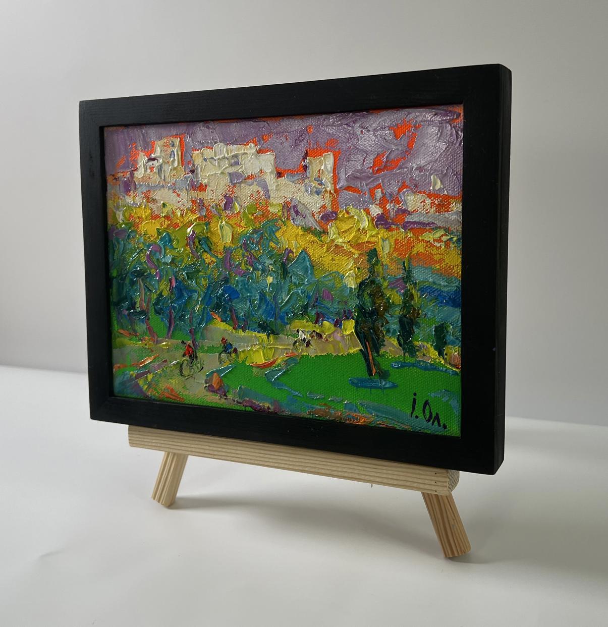 Oil painting On a walk in the city by Oleksiy Ivanyuk in black frame on easel