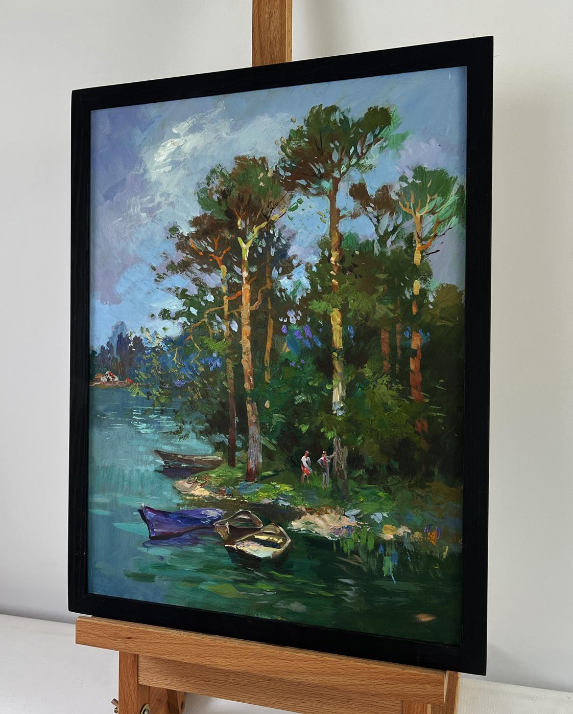Framed oil painting by Yuriy Suprunchuk of serene forest descending to lakeside with boats
