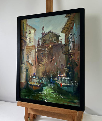 Framed oil painting of Yuriy Suprunchuk sunlit canal with boats