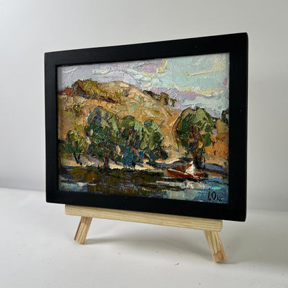 Oil painting High noon heat by Oksana Ivanyuk: green trees, hills, red boat