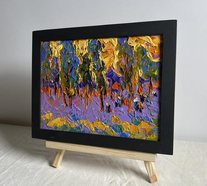Oil painting Yellow sunset behind the trees by Oleksiy Ivanyuk in black frame