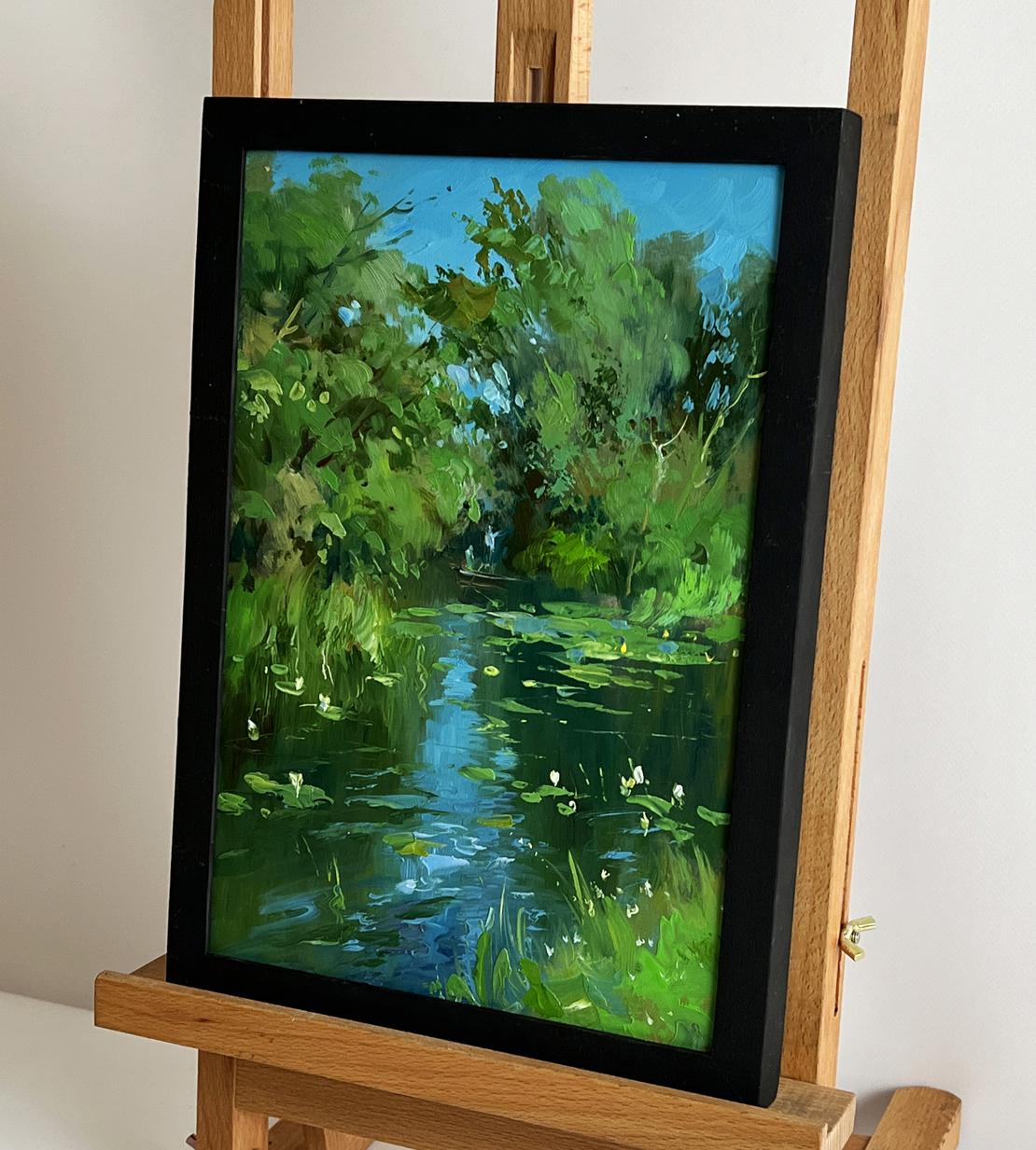 Oil painting of serene forest lake with lily pads by Yuriy Suprunchuk in black frame