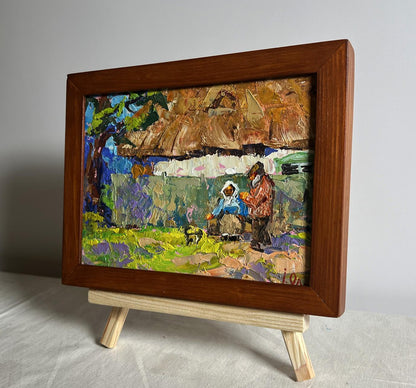 Oil painting Quiet village conversation by Oleksiy Ivanyuk on easel
