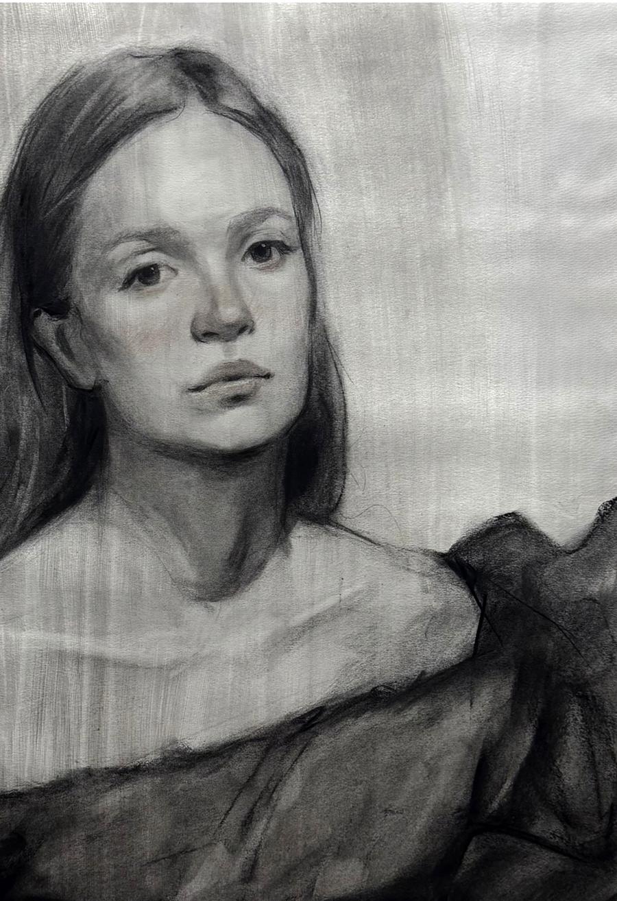 Detailed charcoal portrait sketch of Mariia Annam Butt with long dark hair