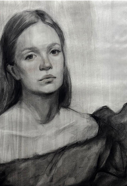 Detailed charcoal portrait sketch of Mariia Annam Butt with long dark hair