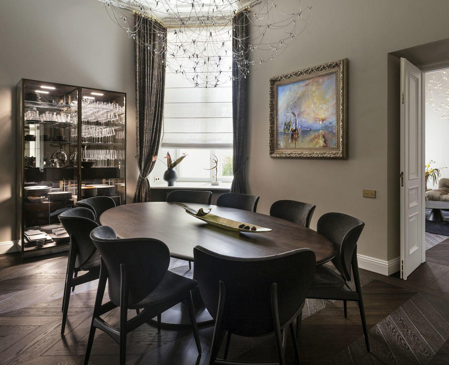 Oil painting of dark wood oval dining table with sleek black chairs by Shining Volodymyr Gluhomanyuk